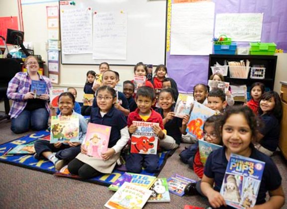 Students hold new books